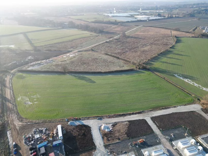 Aerial shot of the site, showing the access track