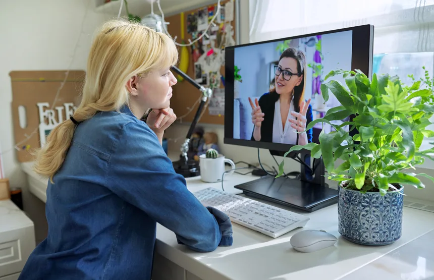 Teen girl talking online with psychologist, social worker