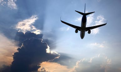 passenger plane flying in clouds