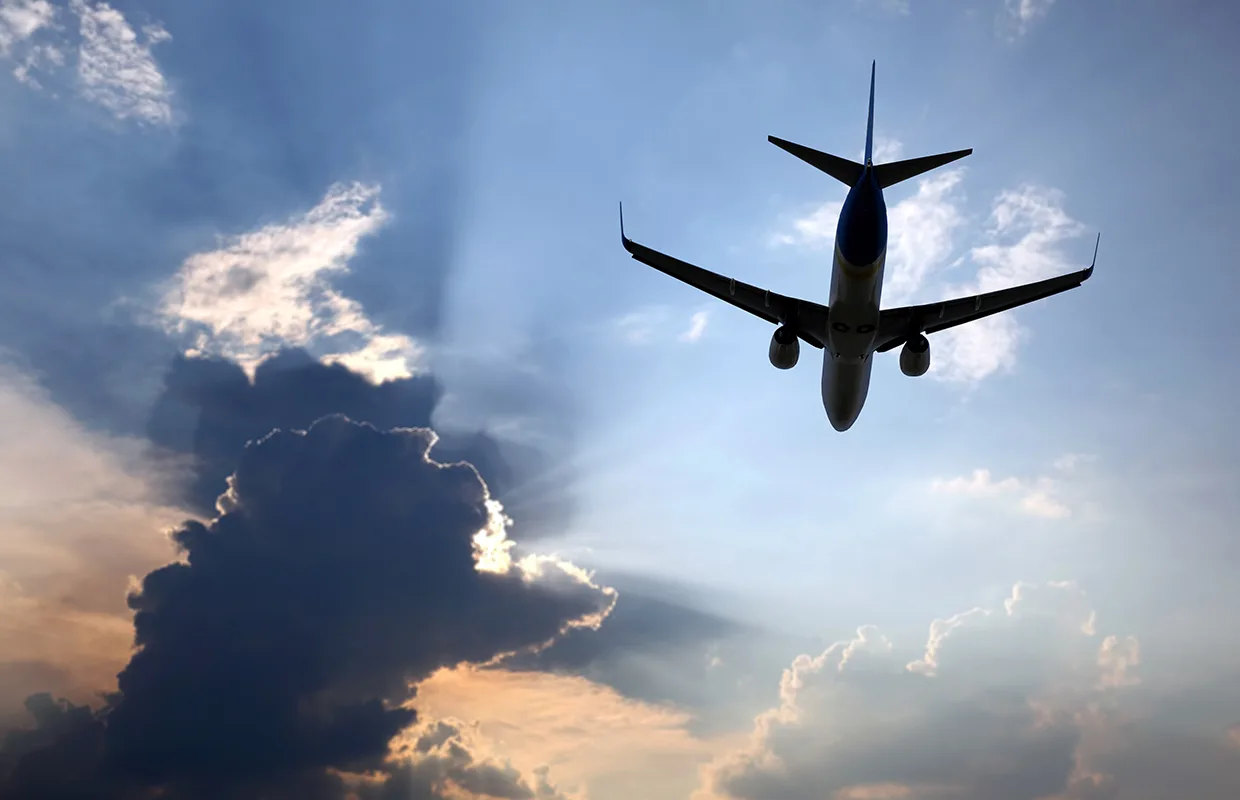 passenger plane flying in clouds