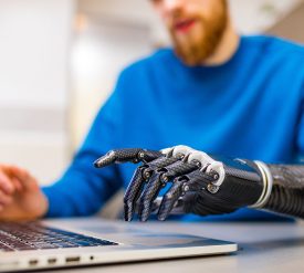Proteor - young man working freelance in laptop at home
