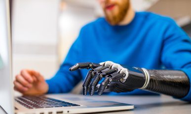 Proteor - young man working freelance in laptop at home