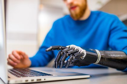 Proteor - young man working freelance in laptop at home