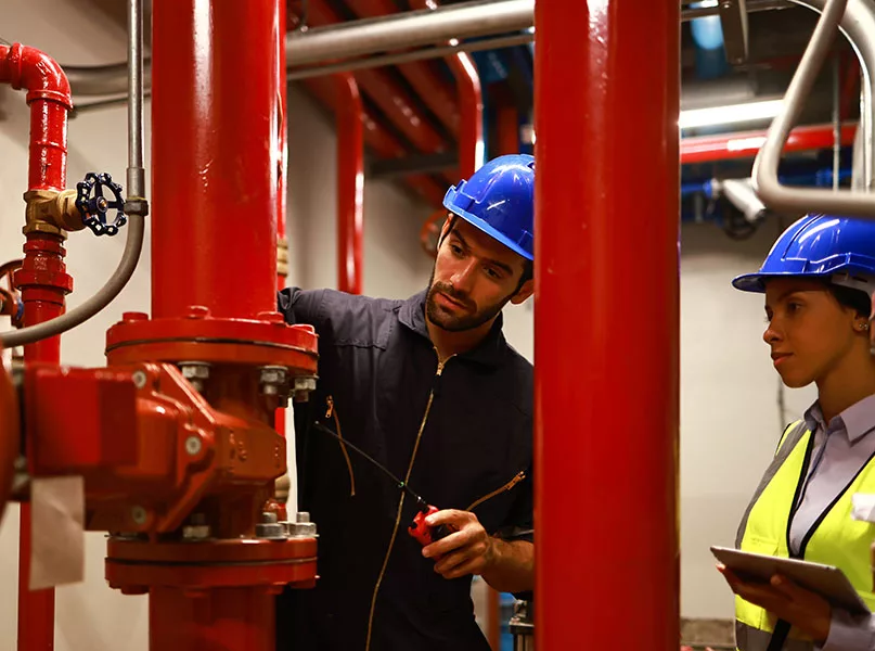 System engineer and technician work checking Fire suppression system