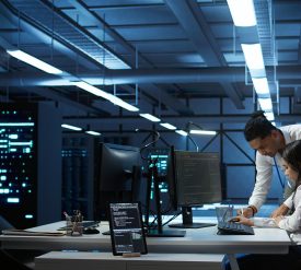 Team of specialists updating server room systems