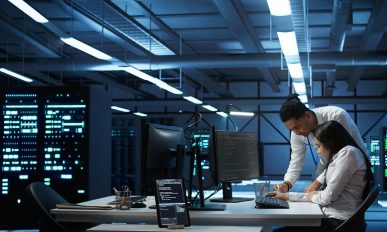 Team of specialists updating server room systems