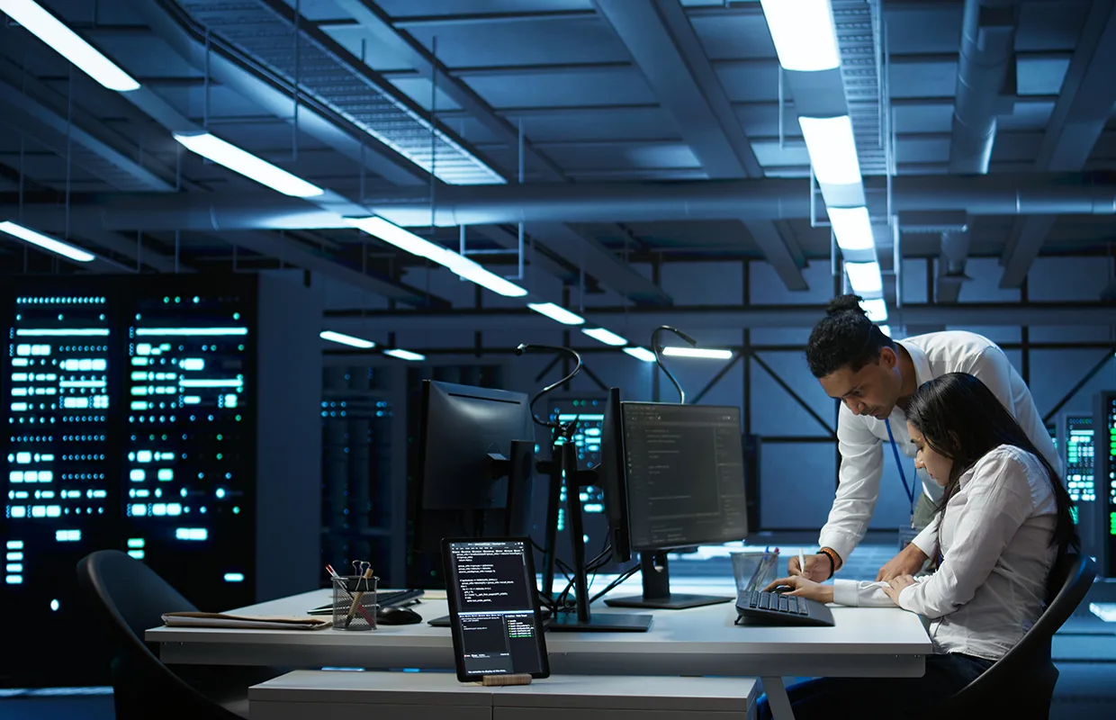 Team of specialists updating server room systems