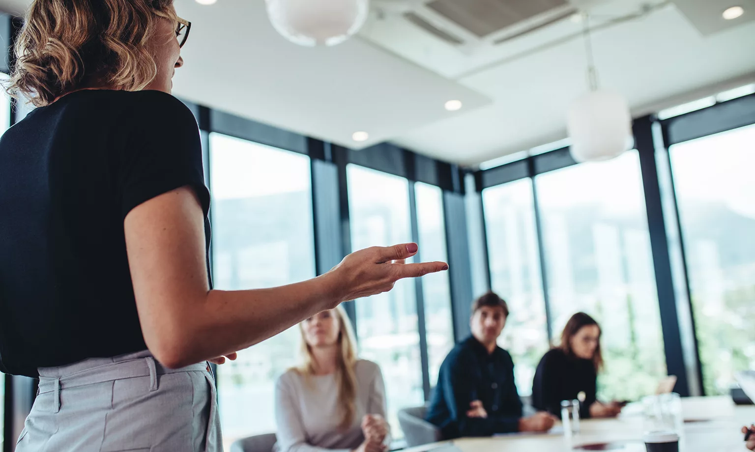 Businesswoman making a presentation to her colleagues in office