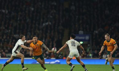 Australia's centre Len Ikitau (2L) passes the ball to the waiting Max Jorgensen (R) before he runs in their late winning try during the Autumn Nations Series International rugby union test match between England and Australia at the Allianz Stadium, Twickenham in south-west London,