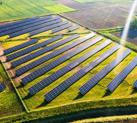 Solar Energy Farm in Fields. Aerial Drone View