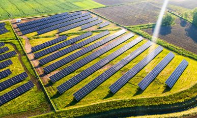 Solar Energy Farm in Fields. Aerial Drone View