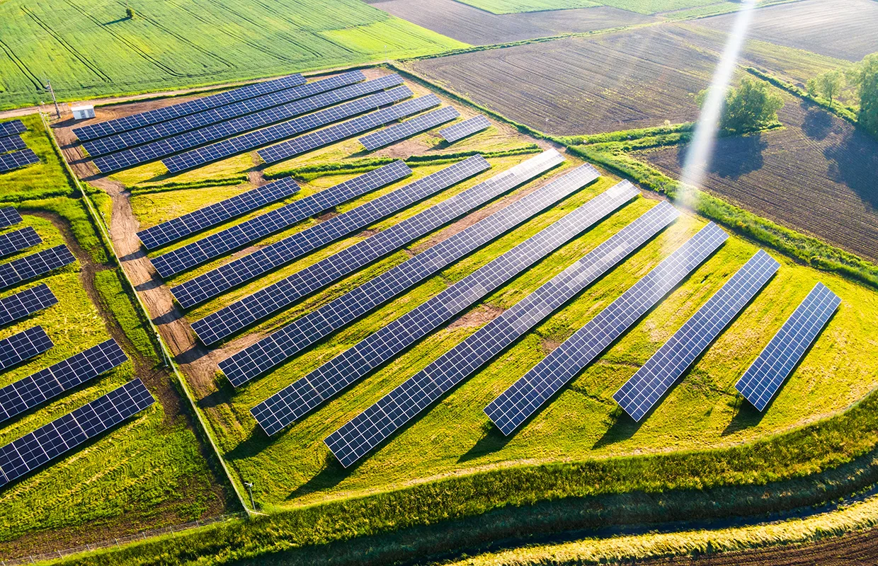 Solar Energy Farm in Fields. Aerial Drone View