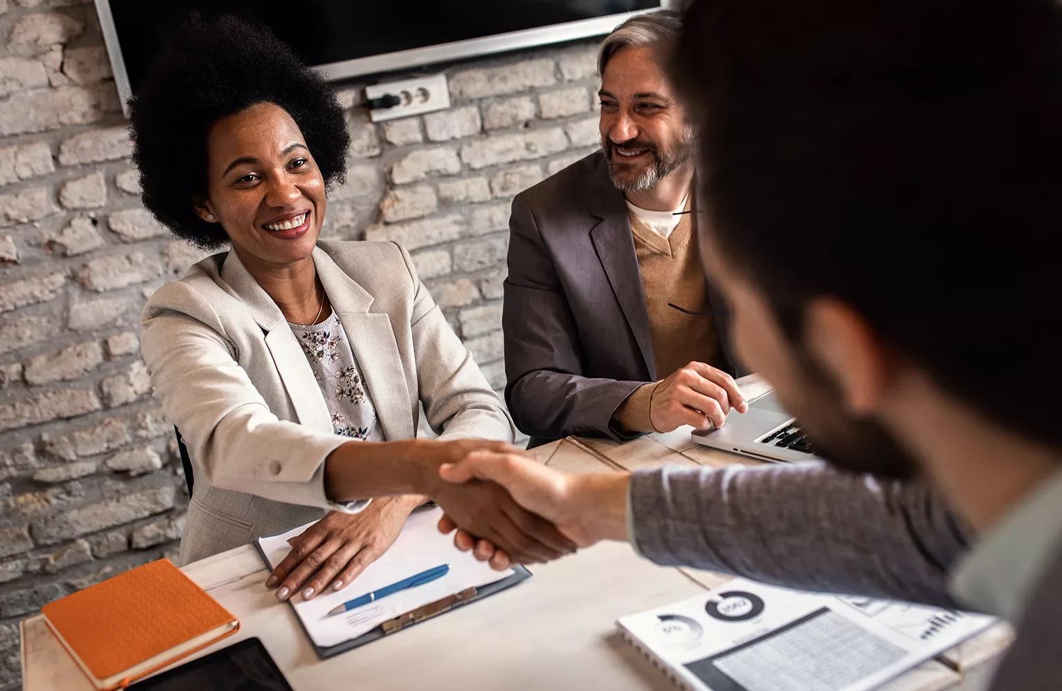 Business recruiters shakes hands with candidate during job inter